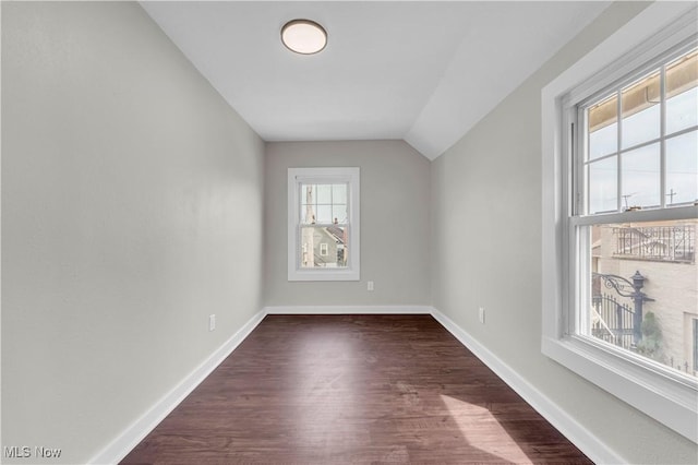 1244 W 69th St, Cleveland, OH 44102 - additional living space featuring dark wood-style flooring, baseboards, and vaulted ceiling