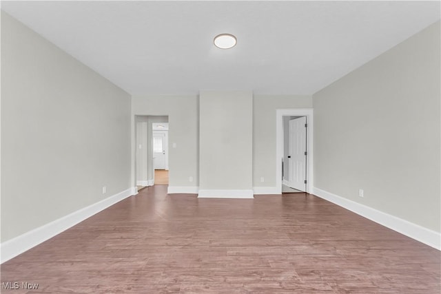 1244 W 69th St, Cleveland, OH 44102 - empty room featuring baseboards and wood finished floors