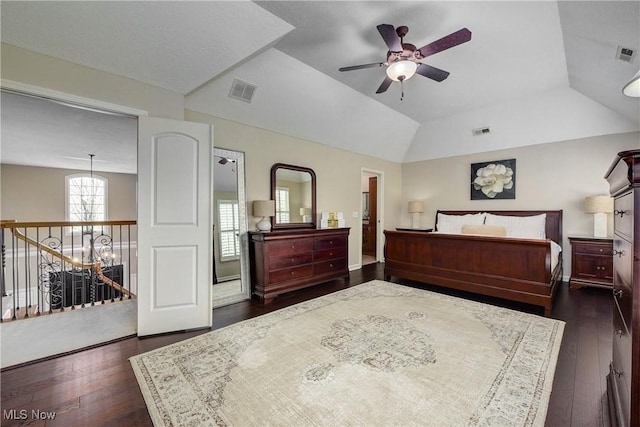 bedroom with dark wood-type flooring and visible vents