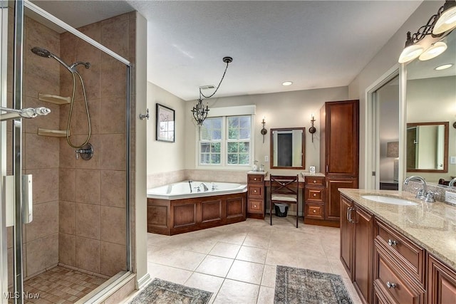 full bathroom featuring a shower stall, a bath, vanity, and tile patterned flooring