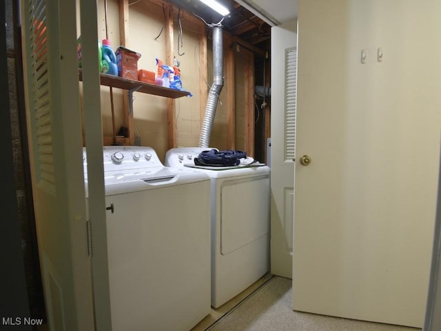 laundry room with laundry area and washing machine and clothes dryer