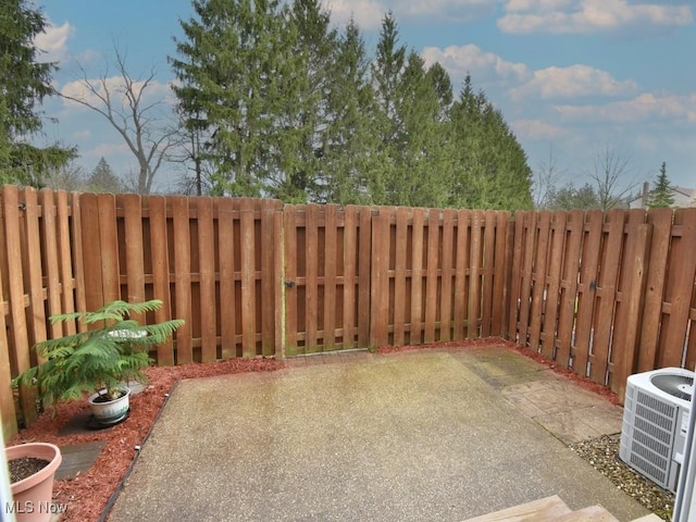 view of patio / terrace featuring a fenced backyard and cooling unit