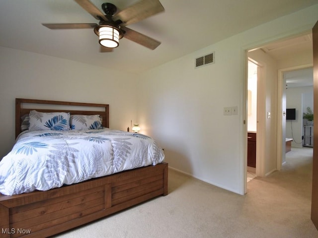 bedroom featuring light colored carpet, baseboards, a ceiling fan, and visible vents