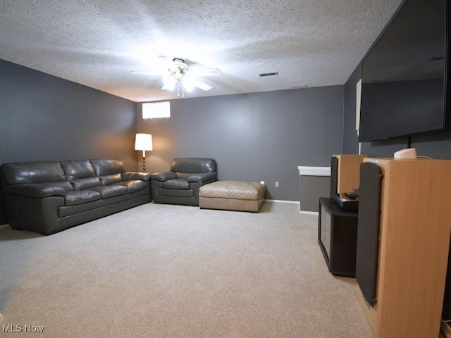 carpeted living area featuring a textured ceiling, baseboards, and visible vents