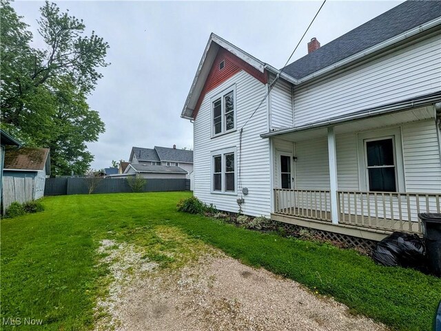 1636 W 8th St, Ashtabula, OH 44004 - view of property exterior featuring a porch and a chimney