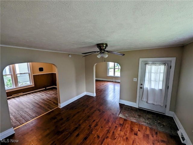 1636 W 8th St, Ashtabula, OH 44004 - foyer with arched walkways, wood finished floors, a textured ceiling, ceiling fan, and baseboards