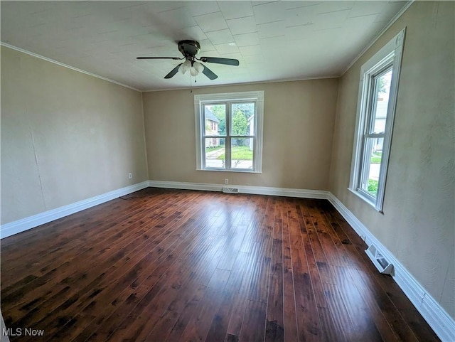 1636 W 8th St, Ashtabula, OH 44004 - unfurnished room featuring plenty of natural light, dark wood-style floors, ornamental molding, ceiling fan, and baseboards