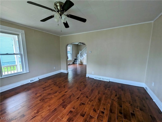 1636 W 8th St, Ashtabula, OH 44004 - spare room featuring arched walkways, dark wood-style floors, ceiling fan, and ornamental molding