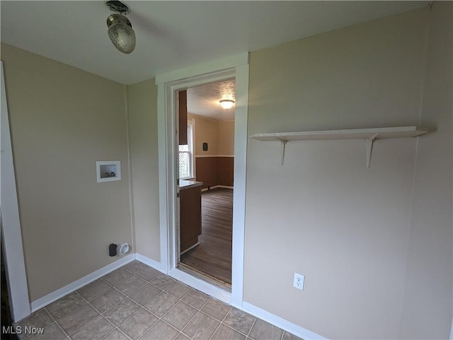 1636 W 8th St, Ashtabula, OH 44004 - laundry room with hookup for a washing machine, baseboards, and light tile patterned floors