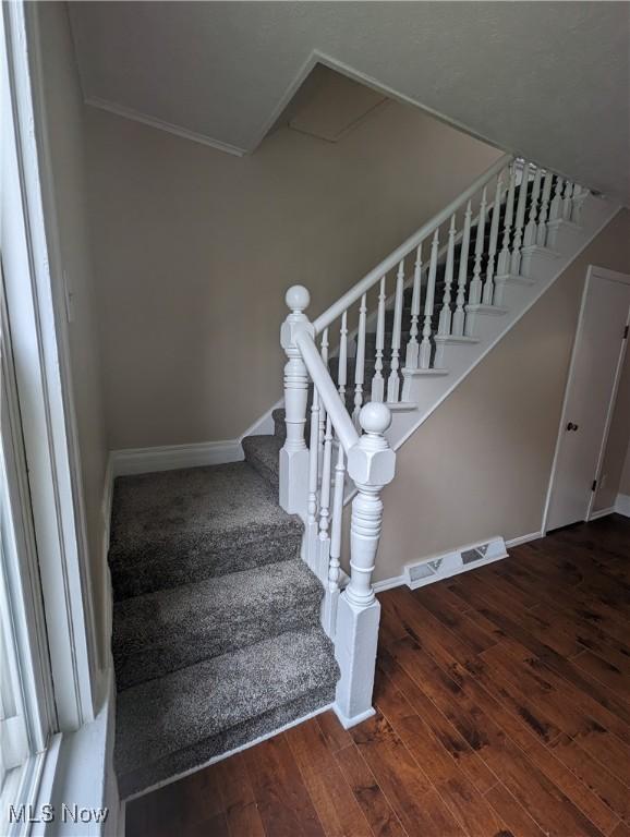 1636 W 8th St, Ashtabula, OH 44004 - stairs featuring wood finished floors, baseboards, and ornamental molding