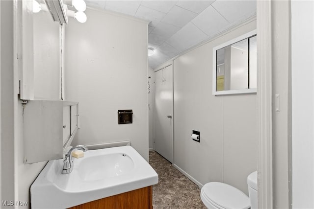 bathroom featuring toilet and vanity