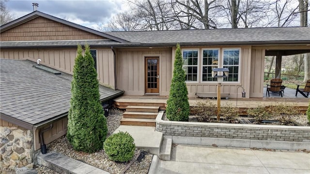7345 Township Road 319, Millersburg, OH 44654 - view of front of property with board and batten siding, a shingled roof, and stone siding