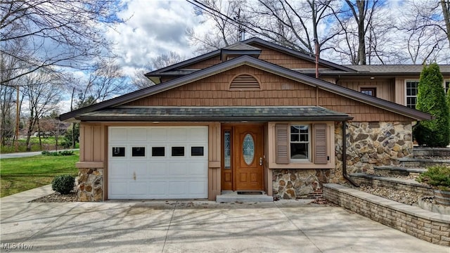 7345 Township Road 319, Millersburg, OH 44654 - view of front of home with a shingled roof, driveway, stone siding, and an attached garage