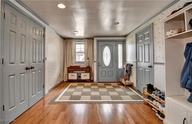 7345 Township Road 319, Millersburg, OH 44654 - mudroom with light wood finished floors, wallpapered walls, and ornamental molding