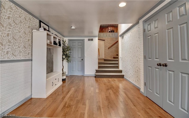 7345 Township Road 319, Millersburg, OH 44654 - mudroom featuring visible vents, light wood finished floors, brick wall, and wallpapered walls