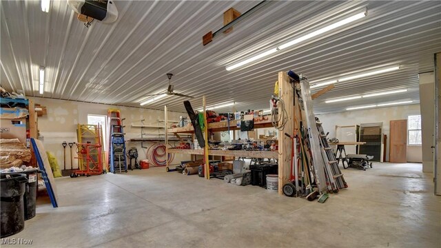 7345 Township Road 319, Millersburg, OH 44654 - garage featuring a garage door opener and a workshop area