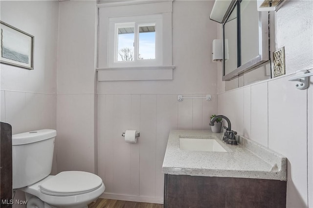 2510 E Midlothian Blvd, Youngstown, OH 44502 - half bath with toilet, vanity, wood finished floors, and wainscoting