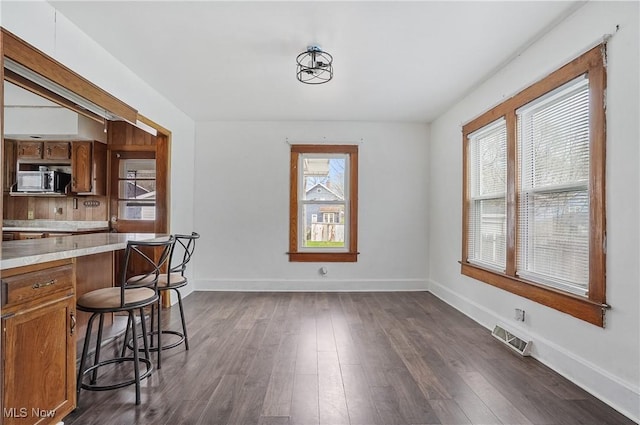 2510 E Midlothian Blvd, Youngstown, OH 44502 - dining space with dark wood-type flooring and baseboards