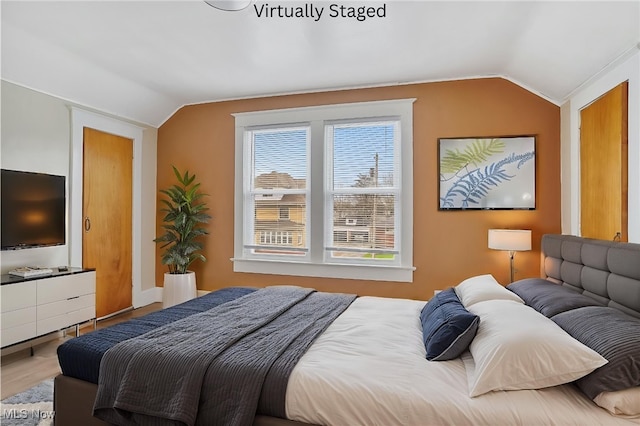 2510 E Midlothian Blvd, Youngstown, OH 44502 - bedroom featuring vaulted ceiling and wood finished floors