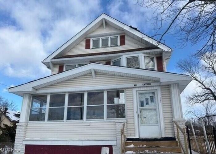 view of front facade featuring a sunroom