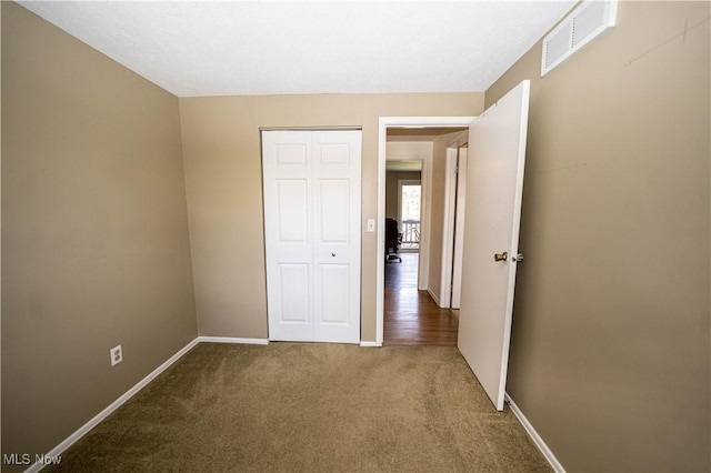 161 Bentwillow Dr, Niles, OH 44446 - unfurnished bedroom featuring visible vents, baseboards, a closet, and carpet floors