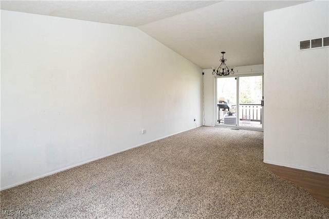 161 Bentwillow Dr, Niles, OH 44446 - empty room featuring visible vents, baseboards, a chandelier, carpet floors, and lofted ceiling
