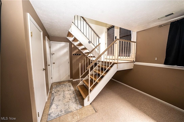 161 Bentwillow Dr, Niles, OH 44446 - stairway with visible vents, baseboards, carpet, and a textured ceiling