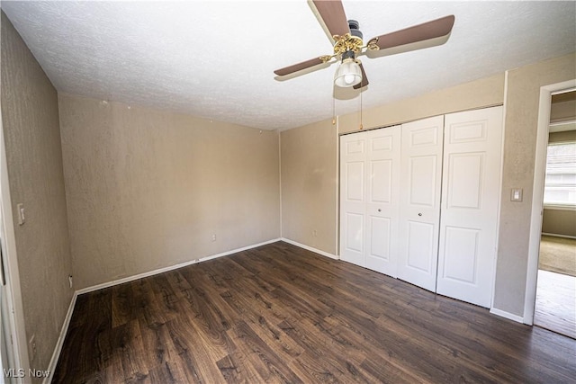 161 Bentwillow Dr, Niles, OH 44446 - unfurnished bedroom featuring a closet, dark wood-style floors, baseboards, and ceiling fan
