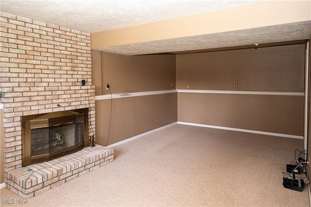 161 Bentwillow Dr, Niles, OH 44446 - finished below grade area featuring carpet, a brick fireplace, a textured ceiling, and baseboards