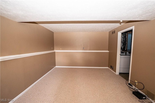 161 Bentwillow Dr, Niles, OH 44446 - spare room with washer / clothes dryer, a textured ceiling, carpet, and visible vents
