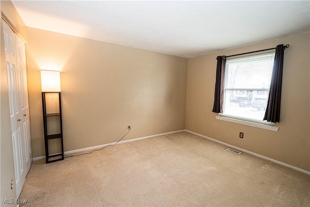 161 Bentwillow Dr, Niles, OH 44446 - unfurnished bedroom with visible vents, baseboards, a closet, and light carpet