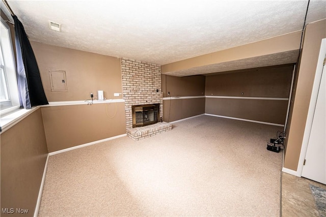 161 Bentwillow Dr, Niles, OH 44446 - unfurnished living room with baseboards, a textured ceiling, visible vents, a brick fireplace, and carpet