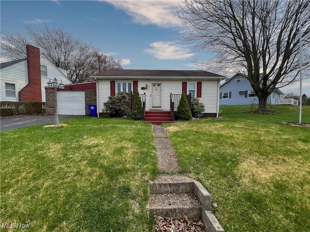 106 N Surry Rd, East Liverpool, OH 43920 - bungalow featuring a front lawn, an outdoor structure, a garage, and driveway