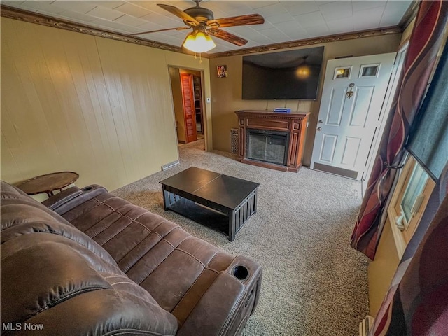 106 N Surry Rd, East Liverpool, OH 43920 - carpeted living room with crown molding, ceiling fan, and a fireplace
