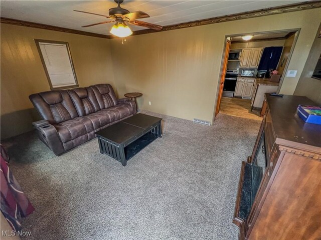 106 N Surry Rd, East Liverpool, OH 43920 - living area with a ceiling fan, light carpet, and ornamental molding