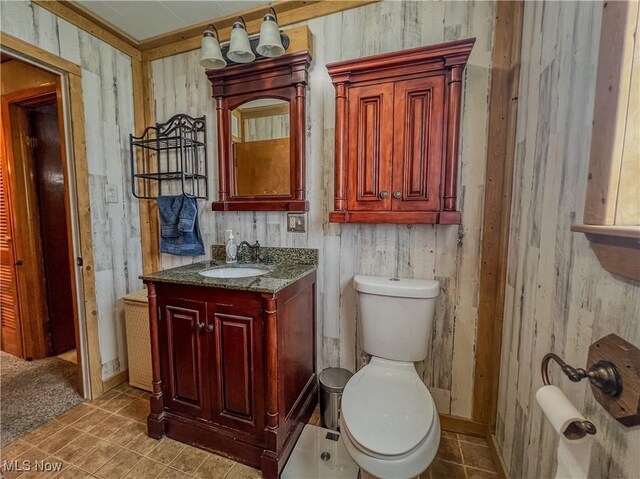 106 N Surry Rd, East Liverpool, OH 43920 - half bath featuring toilet, wood walls, and vanity
