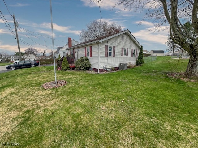 106 N Surry Rd, East Liverpool, OH 43920 - view of property exterior featuring cooling unit and a yard