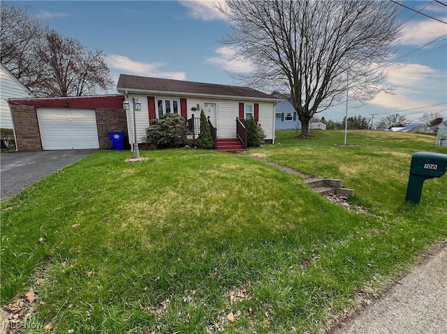 106 N Surry Rd, East Liverpool, OH 43920 - ranch-style home with a garage, driveway, and a front lawn