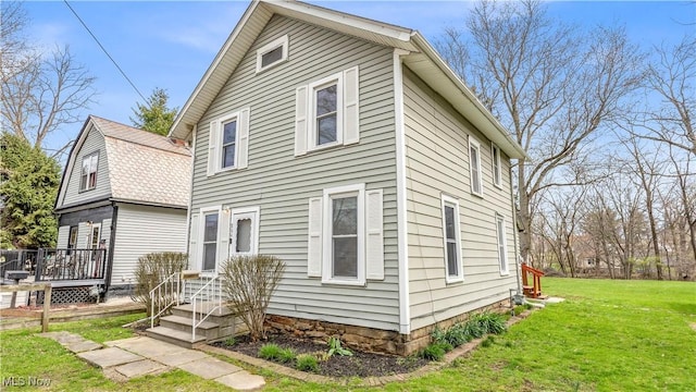 804 E Ave, Elyria, OH 44035 - back of property with a wooden deck and a lawn
