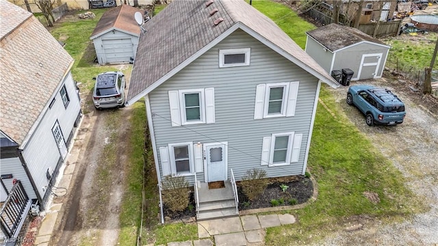 804 E Ave, Elyria, OH 44035 - traditional-style home with roof with shingles, a storage shed, and an outdoor structure
