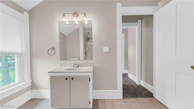 804 E Ave, Elyria, OH 44035 - bathroom with tile patterned flooring, a notable chandelier, vanity, and baseboards