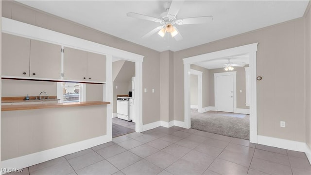 804 E Ave, Elyria, OH 44035 - kitchen with ceiling fan, light tile patterned flooring, light countertops, electric stove, and baseboards
