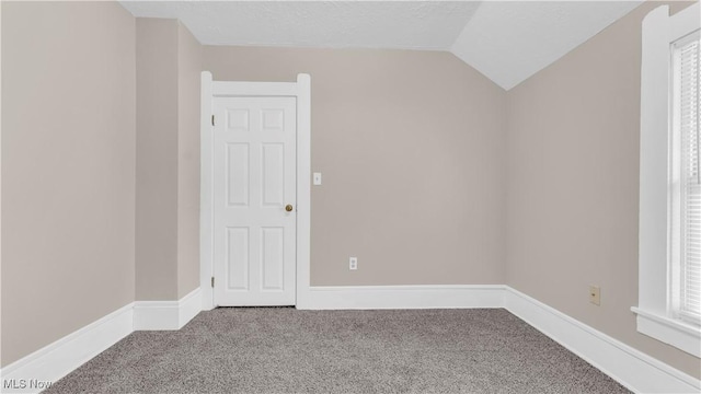 804 E Ave, Elyria, OH 44035 - additional living space with carpet flooring, baseboards, and vaulted ceiling