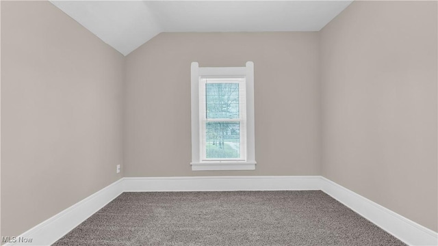 804 E Ave, Elyria, OH 44035 - carpeted spare room with baseboards and lofted ceiling