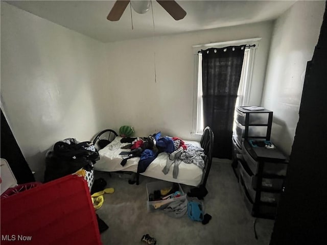 carpeted bedroom featuring a ceiling fan