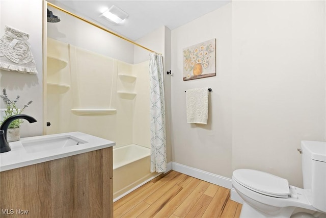full bathroom featuring vanity, baseboards, shower / bath combo, toilet, and wood finished floors