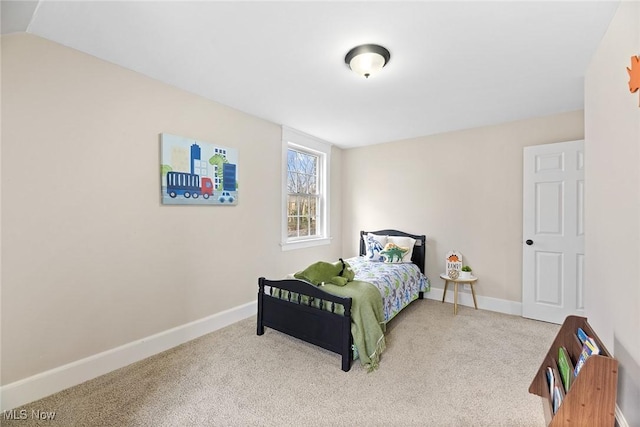 bedroom with baseboards and carpet floors