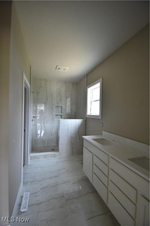 1486 Lake Front Blvd, North Lima, OH 44452 - bathroom with a marble finish shower, marble look tile flooring, and double vanity