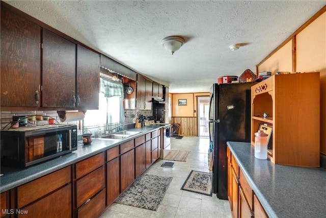 kitchen featuring a wealth of natural light and a textured ceiling