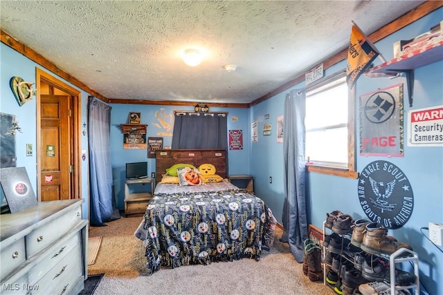 carpeted bedroom featuring a textured ceiling